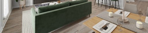 a living room with a couch and a table with chairs at Ashford Townes Apartments, Fuquay-Varina, 27526