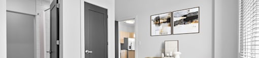 a bedroom with a bed and a chair in a 555 waverly unit