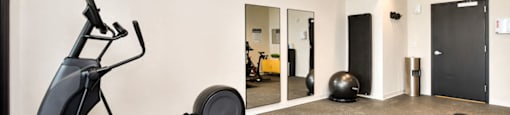 the gym at the flats at big tex apartments