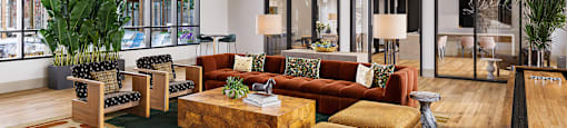 A large room with a lot of furniture and a pool table.