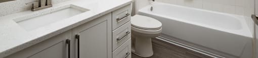 a bathroom with a sink toilet and a bath tub