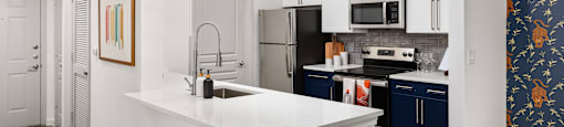 a kitchen with an island and two stools