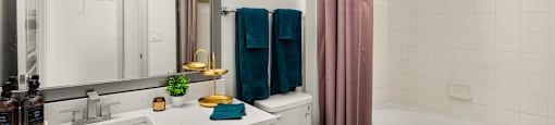 a bathroom with a sink toilet and tub and a shower