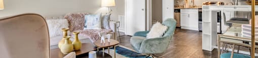a living room with a couch chair and coffee table  at Castilian Apartments, Orlando, FL, 32839