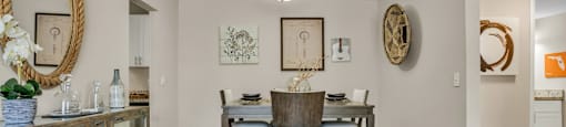 a dining room with a table and chairs  at Castilian Apartments, Orlando, FL