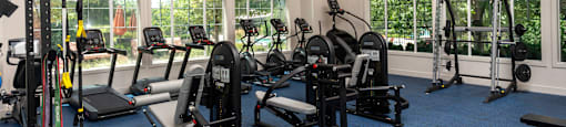 a room filled with lots of different types of exercise equipment