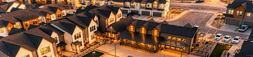 A large residential complex with a swimming pool.