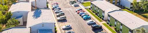 an aerial view of a parking lot in a city with cars parked at Westmount at Downtown Tempe, Tempe, AZ