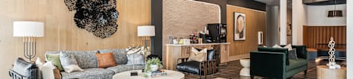 a lobby with couches and chairs and a coffee table