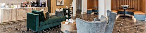 a lobby with couches and chairs and a coffee table