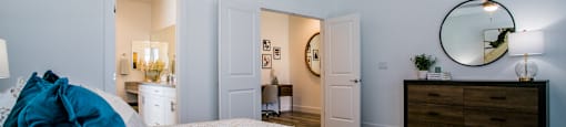 a bedroom with a large bed and a dresser with a mirrorat Townes at Peace Way, Nevada