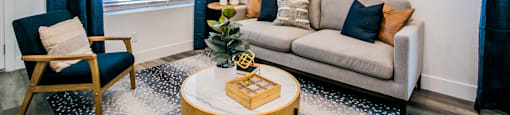 a living room with a couch chair and coffee tableat Townes at Peace Way, Las Vegas, 89147