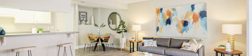 a living room with a gray couch and a gray coffee table