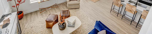 An aerial view of a living room with chairs and a coffee table at Mt. Rainier houses for rent in SLC, Utah.
