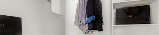 A closet with wall shelves at Mt. Rainier Herriman townhomes for rent.