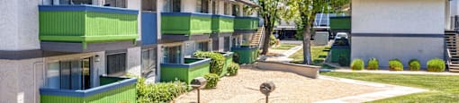 A view of a courtyard in front of apartment homes at Westmount at Urban Trails, Mesa, Arizona