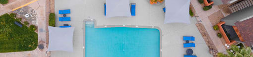 arial view of a swimming pool in a house with umbrellas