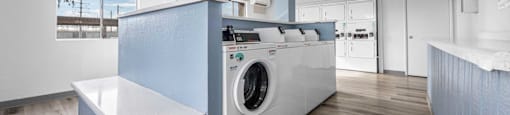 a kitchen with a washing machine in it