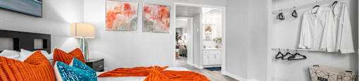 a bedroom with a large bed and a closet