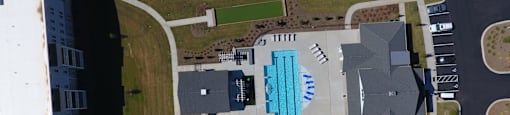 an overhead view of a swimming pool on the side of a building