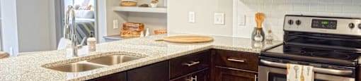 a kitchen with stainless steel appliances and granite counter tops