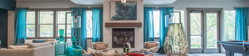 a living room with a large table and a fireplace