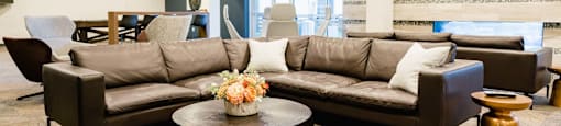 a lobby with couches and chairs and a table in a downtown Salt lake City apartment community