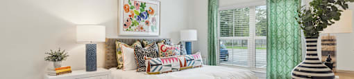a bedroom with a bed and a ceiling fan