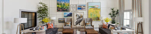 a living room with couches and chairs and a fireplace