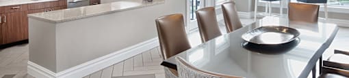 a kitchen and dining room with a table and chairs