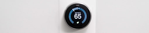 an electric thermostat with a white background