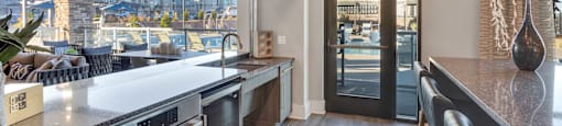 A modern kitchen with a view of the city.