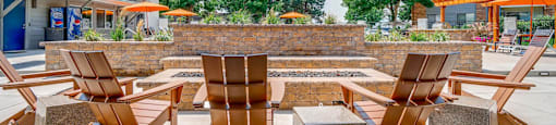 A sunny day at the outdoor seating area with wooden chairs and tables.