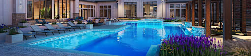 A large house with a swimming pool in front.