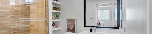 A bathroom with a wooden wall and a white toilet.