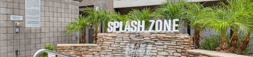 A pool with a sign that says splash zone.