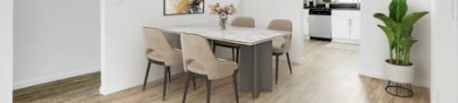 A dining room with a table and chairs.