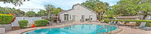 A small pool surrounded by a brick patio.