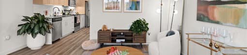 A modern living room with a grey sofa and a wooden coffee table.