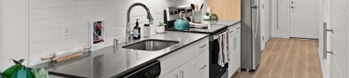 A modern kitchen with wooden cabinets and stainless steel appliances.