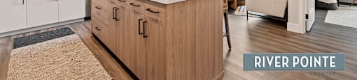 A modern kitchen with wooden cabinets and a central island.