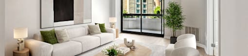 a living room with a white couch and a table    and a balcony