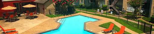 Community pool with lounge chairs