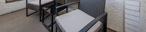 A patio with a table and chairs is shown.