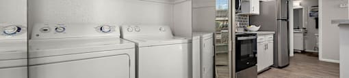 A laundry room with a full size washer and dryer.