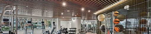Renovated Fitness Center with a variety of equipment including weights and machines.