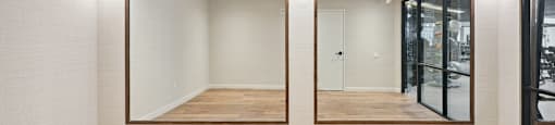 Yoga Room with a wooden floor and a mirrored wall.
