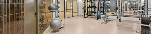 State-of-the-art Fitness Center with a variety of equipment including weights and machines.
