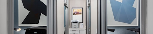 a conference room with a desk and a door
