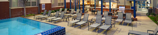 our apartments have a large pool and lounge area with chairs